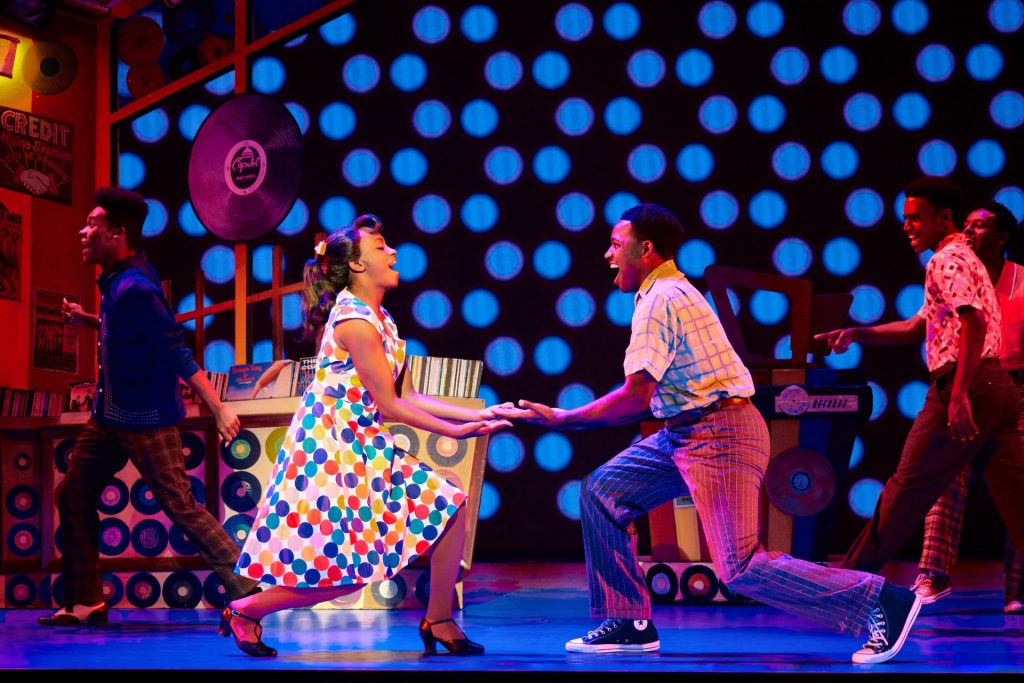 (from L) Joi D. McCoy as “Little Inez” and Charlie Bryant III as “Seaweed J. Stubbs” and the Company of Hairspray. Photo: Jeremy Daniel.