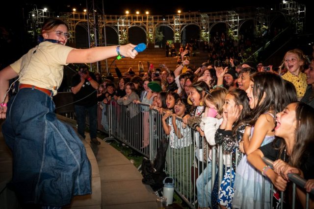 PBS SoCal in Southern California with “Chinatown Punk Wars Bela Salazar of The Linda Lindas with fans at the premiere of ARTBOUND “Chinatown Punk Wars” at Grand Performances on September 22, 2023. Photo courtesy of KCET.