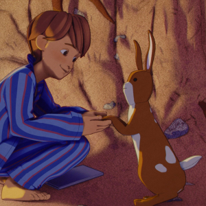 William (voiced by Phoenix Laroche) and Velveteen Rabbit (voiced by Alex Lawther) in "The Velveteen Rabbit," premiering November 22, 2023 on Apple TV+.
