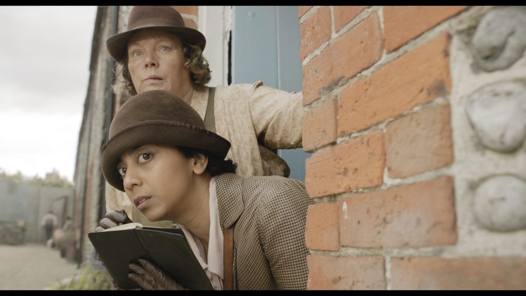 Anjana Vasan as Gladys Moss, Joanna Scanlan as Ann in 'Wicked Little Letters' Image: Parisa Taghizadeh. Courtesy of Sony Pictures Classics