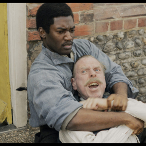 Timothy Spall as Edward Swan, Malachi Kirby as Bill in 'Wicked Little Letters' Image: Parisa Taghizadeh. Courtesy of Sony Pictures Classics