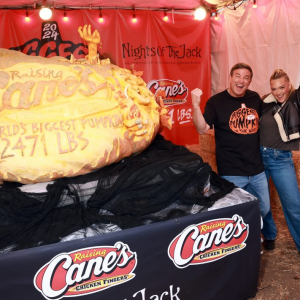 CALABASAS, CALIFORNIA - OCTOBER 30: (L-R) Todd Graves, CEO, Raising Cane's, and Camille Kostek   (Photo by Matt Winkelmeyer/Getty Images for Raising Cane's)