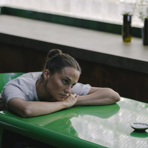 Alicia Vikander in THE ASSESSMENT, a Magnolia Pictures release. Photo credit: Jörn Neumann. © 2024 Number 9 Films Assessment Limited, TA Co-Production GmbH, ShivHans Productions, LLC, TA2022 Investors, LLC, Tiki Tāne Pictures, LLC. Photo courtesy of Magnolia Pictures.