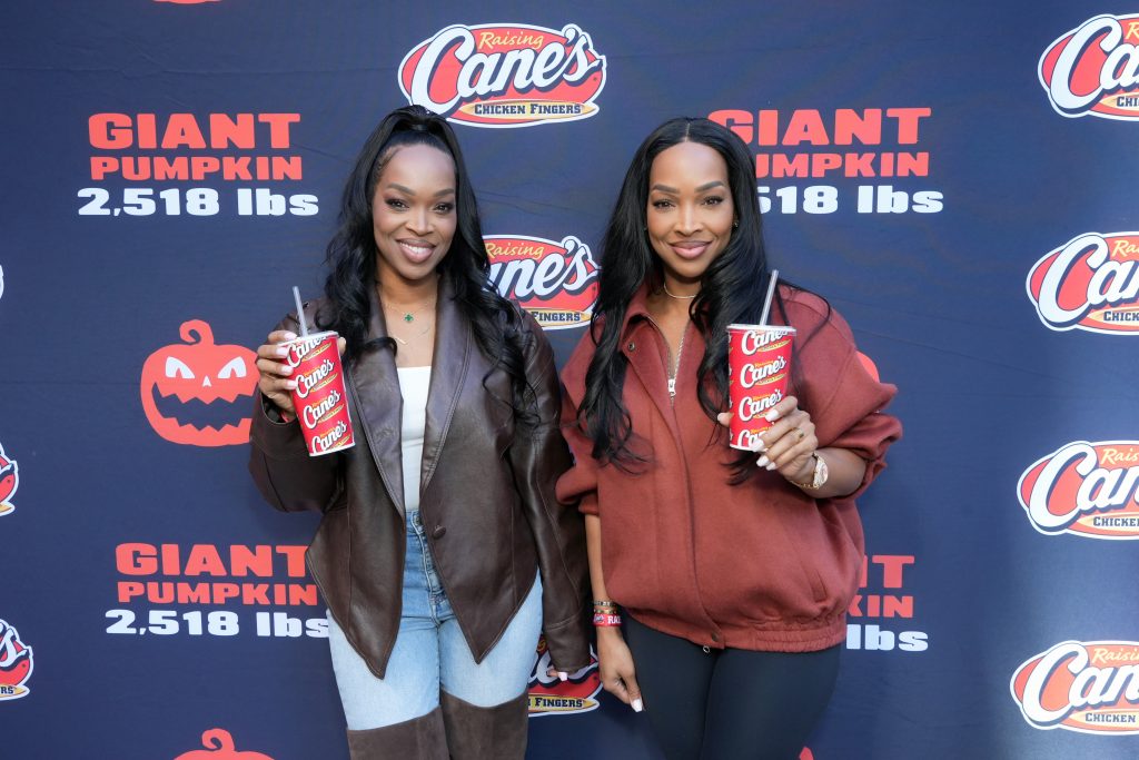 LOS ANGELES, CALIFORNIA - OCTOBER 29: (L-R) Malika Haqq and Khadijah Haqq attend Raising Cane's unveiling of a giant jack-o'-lantern with Todd Graves and celebrity friends at Hollywood & Highland in Los Angeles, California. (Photo by Gonzalo Marroquin/Getty Images for Raising Cane's)