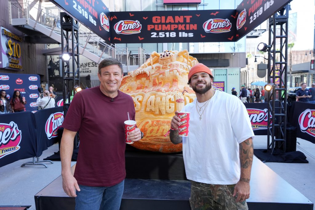 LOS ANGELES, CALIFORNIA - OCTOBER 29: (L-R) Todd Graves, CEO, Raising Cane's and Cory Wharton attend Raising Cane's unveiling of a giant jack-o'-lantern with Todd Graves and celebrity friends at Hollywood & Highland in Los Angeles, California. (Photo by Gonzalo Marroquin/Getty Images for Raising Cane's)
