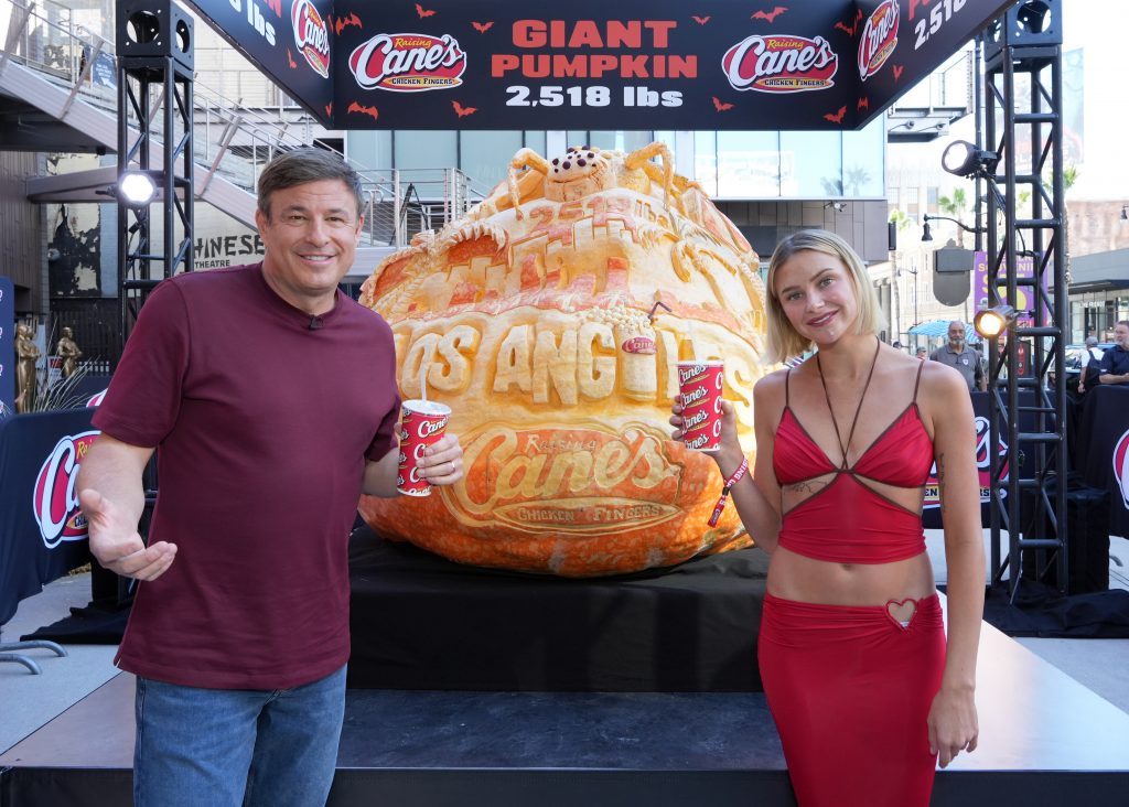 LOS ANGELES, CALIFORNIA - OCTOBER 29: (L-R) Todd Graves, CEO, Raising Cane's and Dayna Marie attend Raising Cane's unveiling of a giant jack-o'-lantern with Todd Graves and celebrity friends at Hollywood & Highland in Los Angeles, California. (Photo by Gonzalo Marroquin/Getty Images for Raising Cane's)