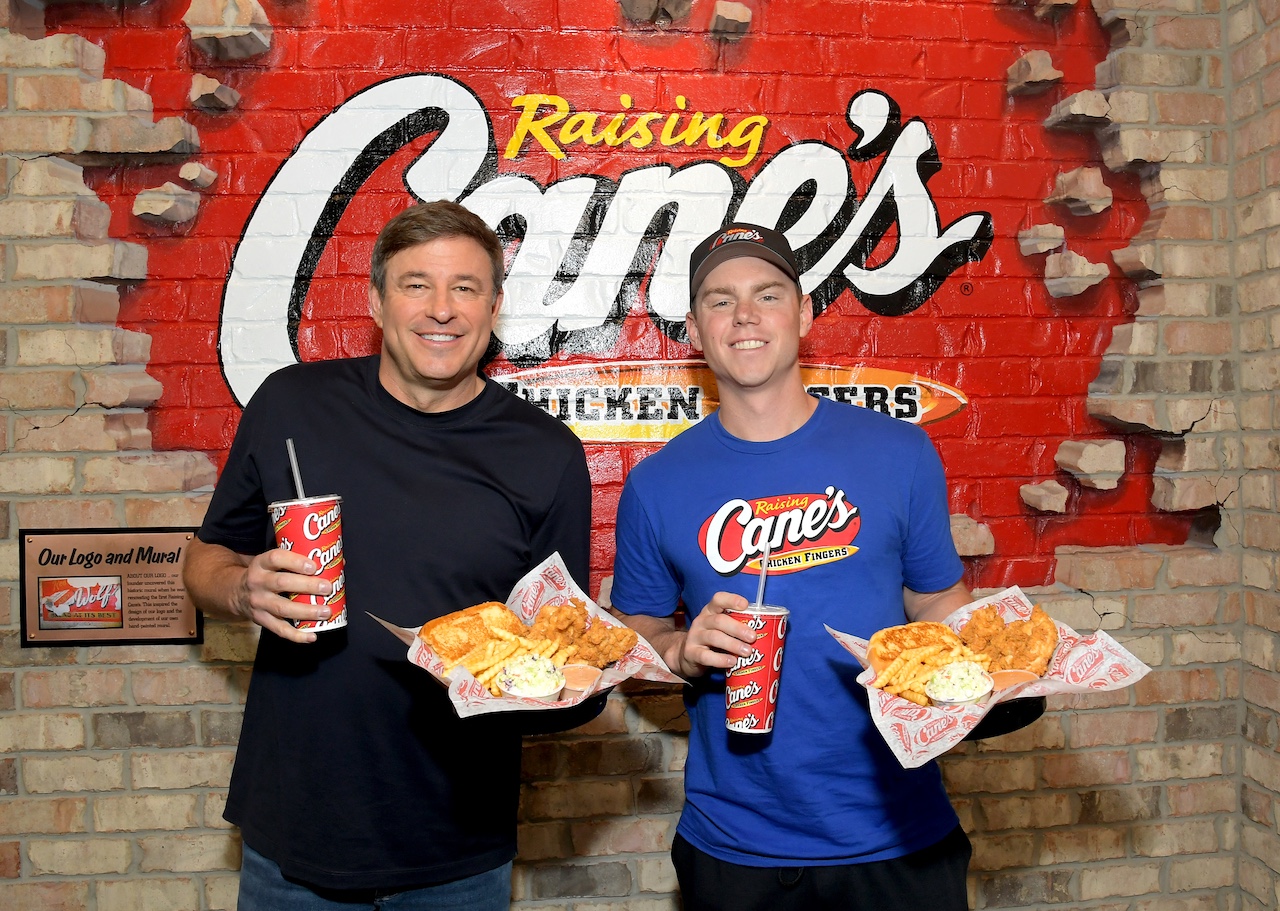 LOS ANGELES, CALIFORNIA - NOVEMBER 05: LA Dodgers Catcher Will Smith (R) poses with Raising Cane's CEO Todd Graves (L) during his Celebratory World Series "Shift" at Raising Cane'son November 05, 2025 in Los Angeles, California. (Photo by Charley Gallay/Getty Images for Raising Cane's)